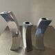 Trio of cast aluminum candle holders