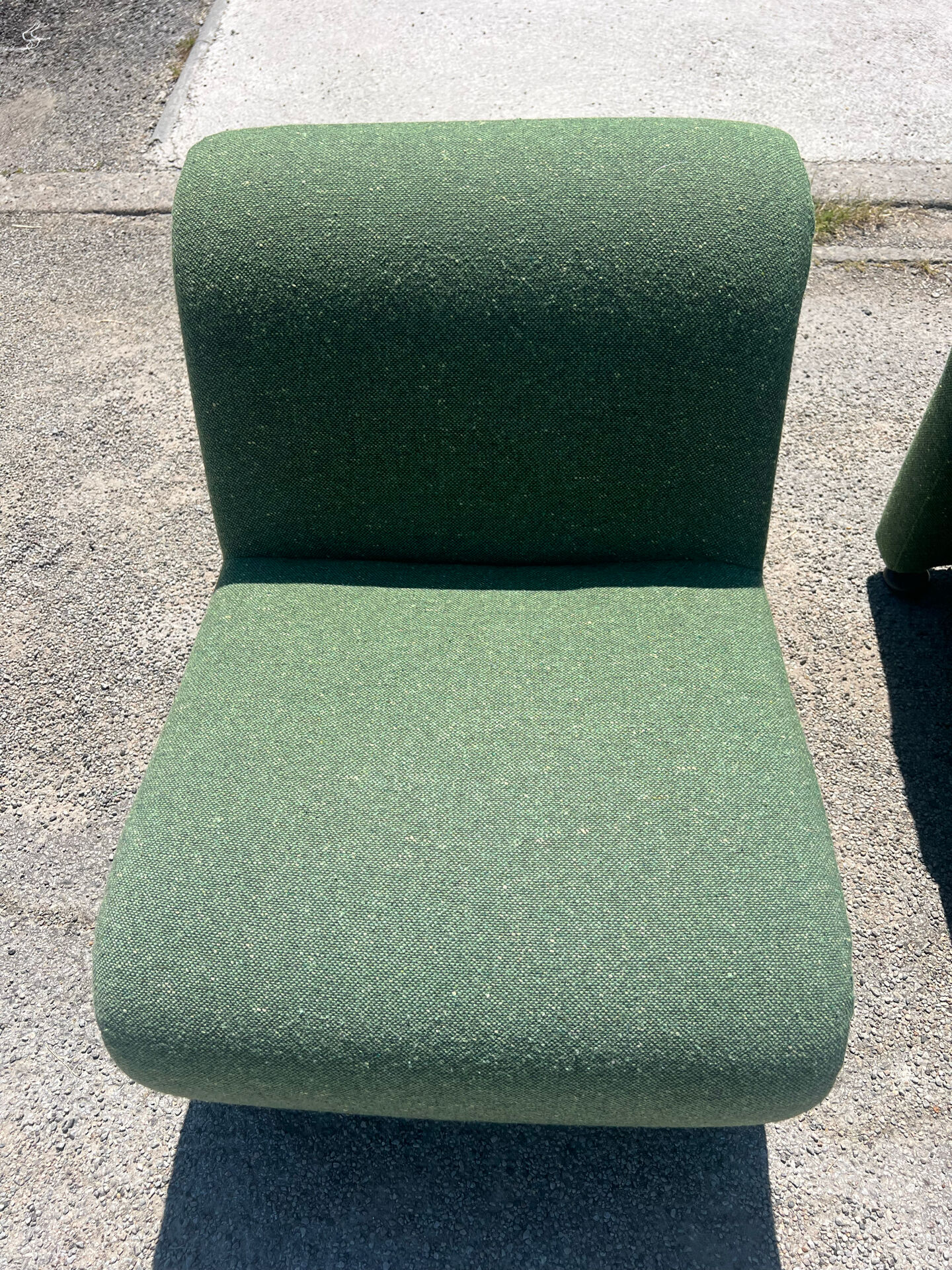 Green armchairs designed by Étienne Fermigier