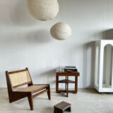 Reclined armchair in canned teak in natural wood