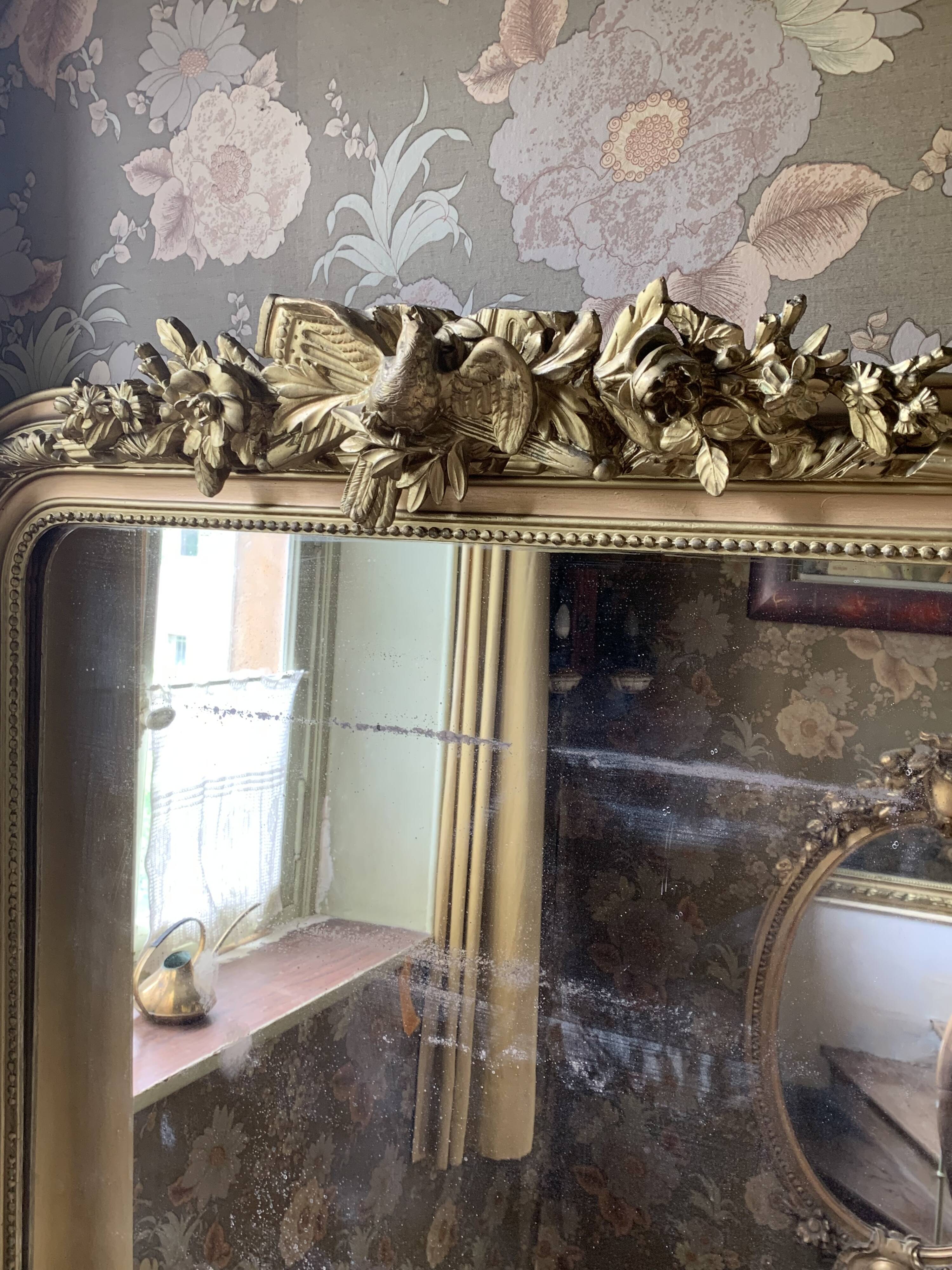 Gilded wooden fireplace mirror with pediment