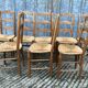 8 antique Vendée straw chairs in solid cherry wood.