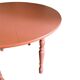 Round wooden table with drop-leaf sides