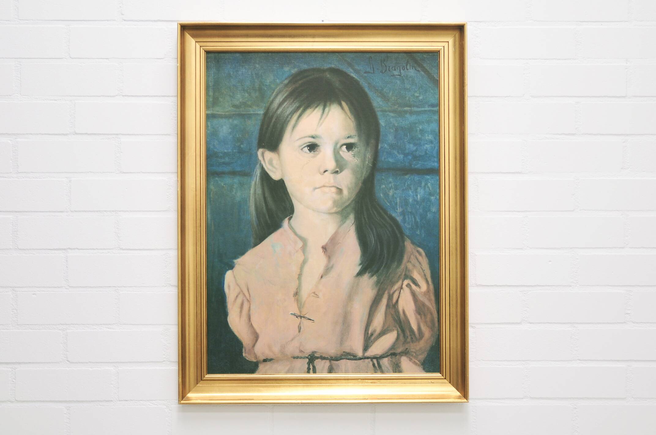 vintage gold frame with portrait of crying girl by Bragolin