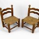Pair of low straw chairs  circa 1940