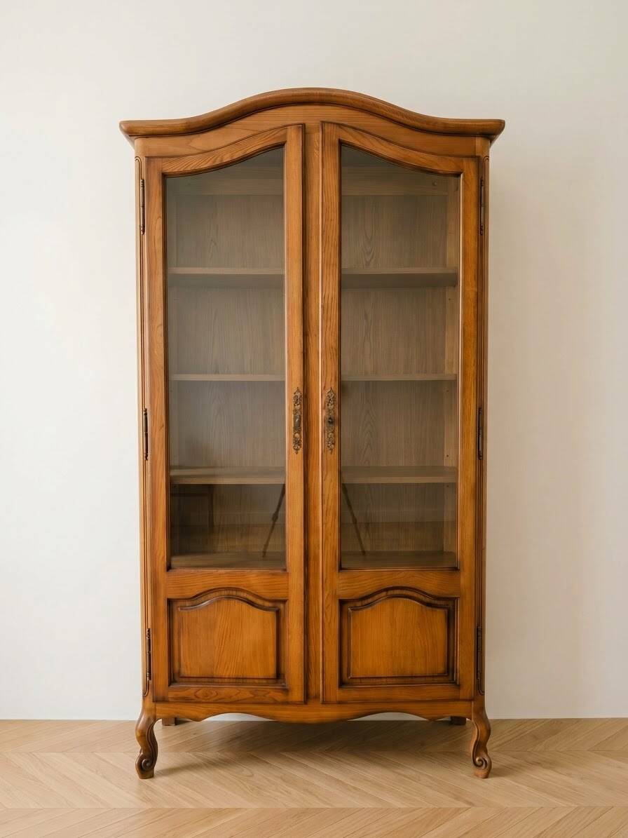 Antique wooden display cabinet with glass doors.