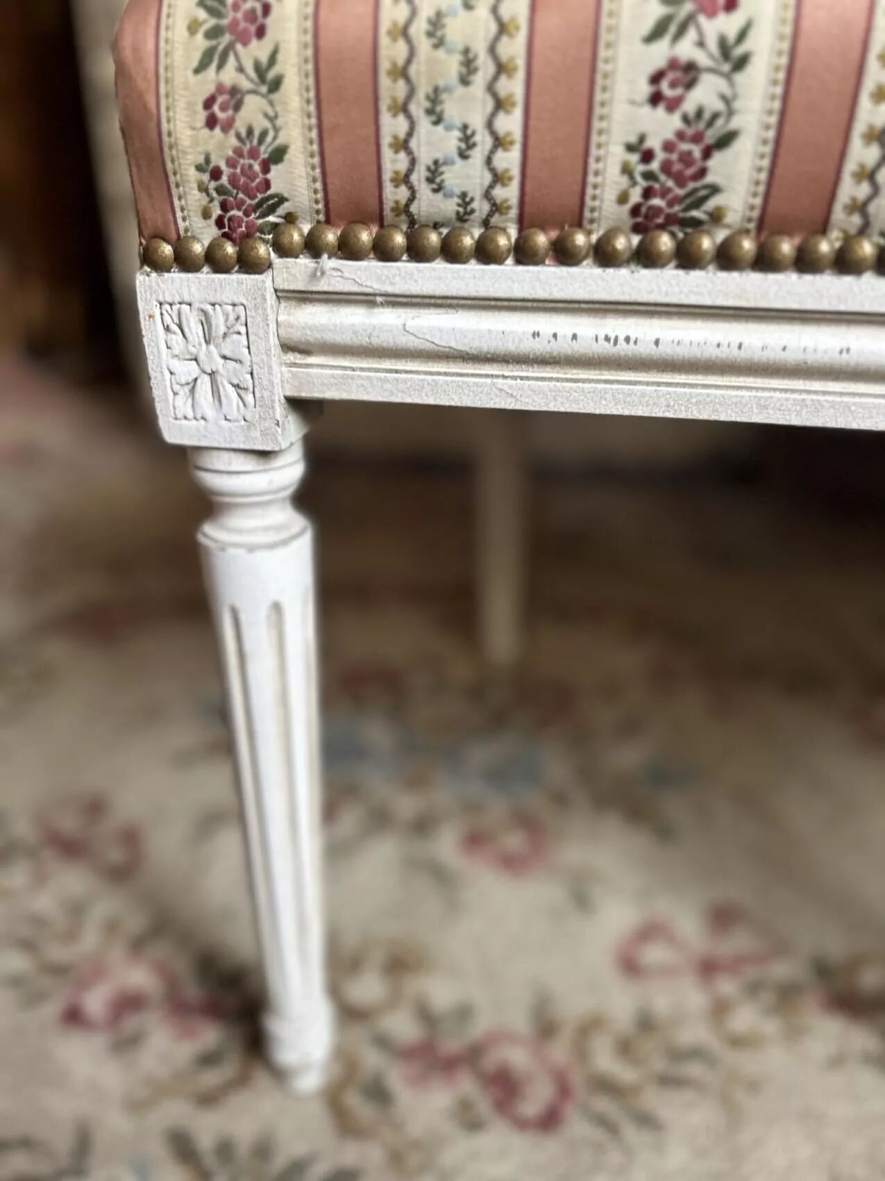 Pair of Louis XVI style chairs in painted wood and satin, classic elegance.