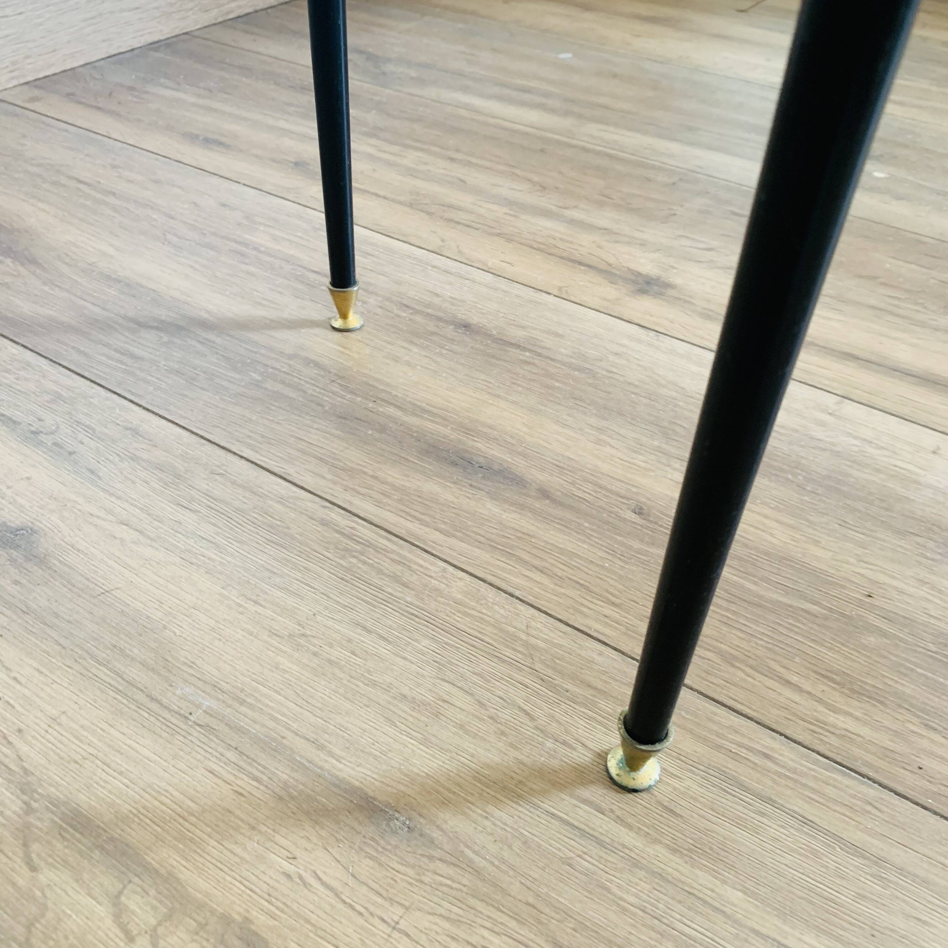 Coffee table from the 50s/60s, glass, brass, black metal.