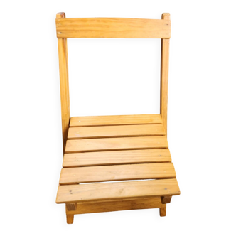 Children's folding chair made of wood.