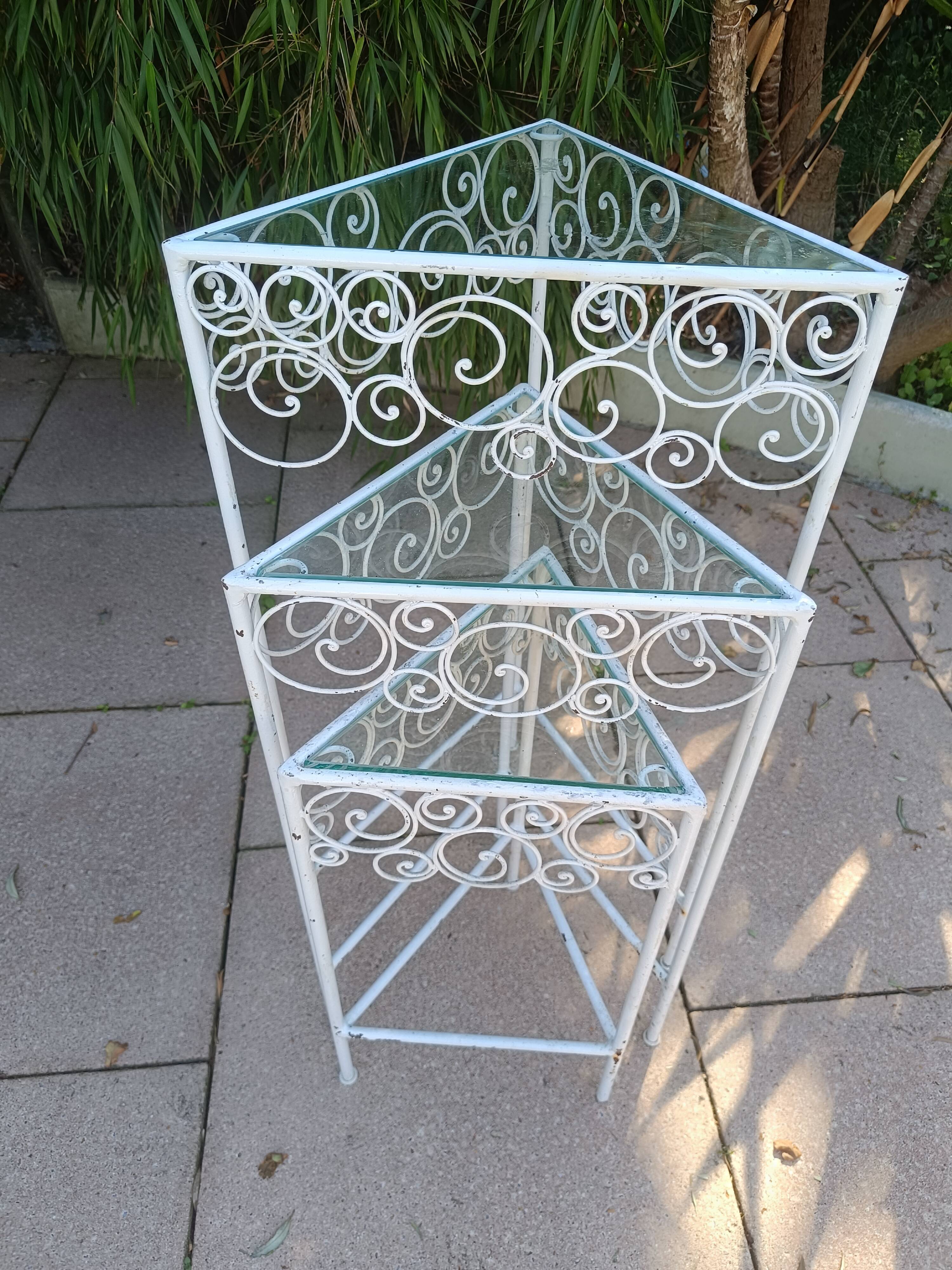 3 nesting tables in white wrought iron. Beveled glass.