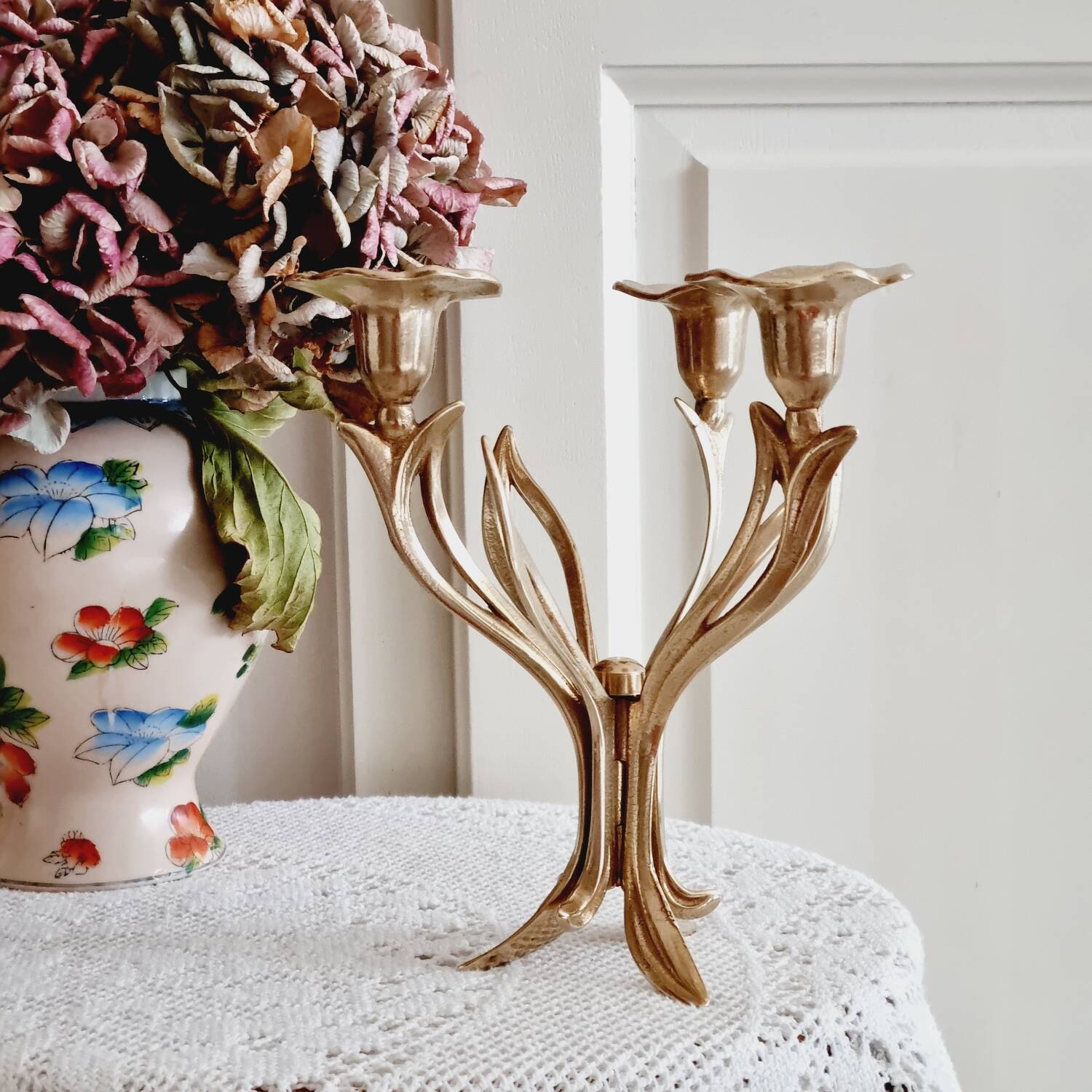 Tall brass flower candlestick