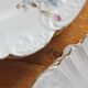 12 assiettes à dessert en porcelaine ancienne décor polychrome floral début XXe