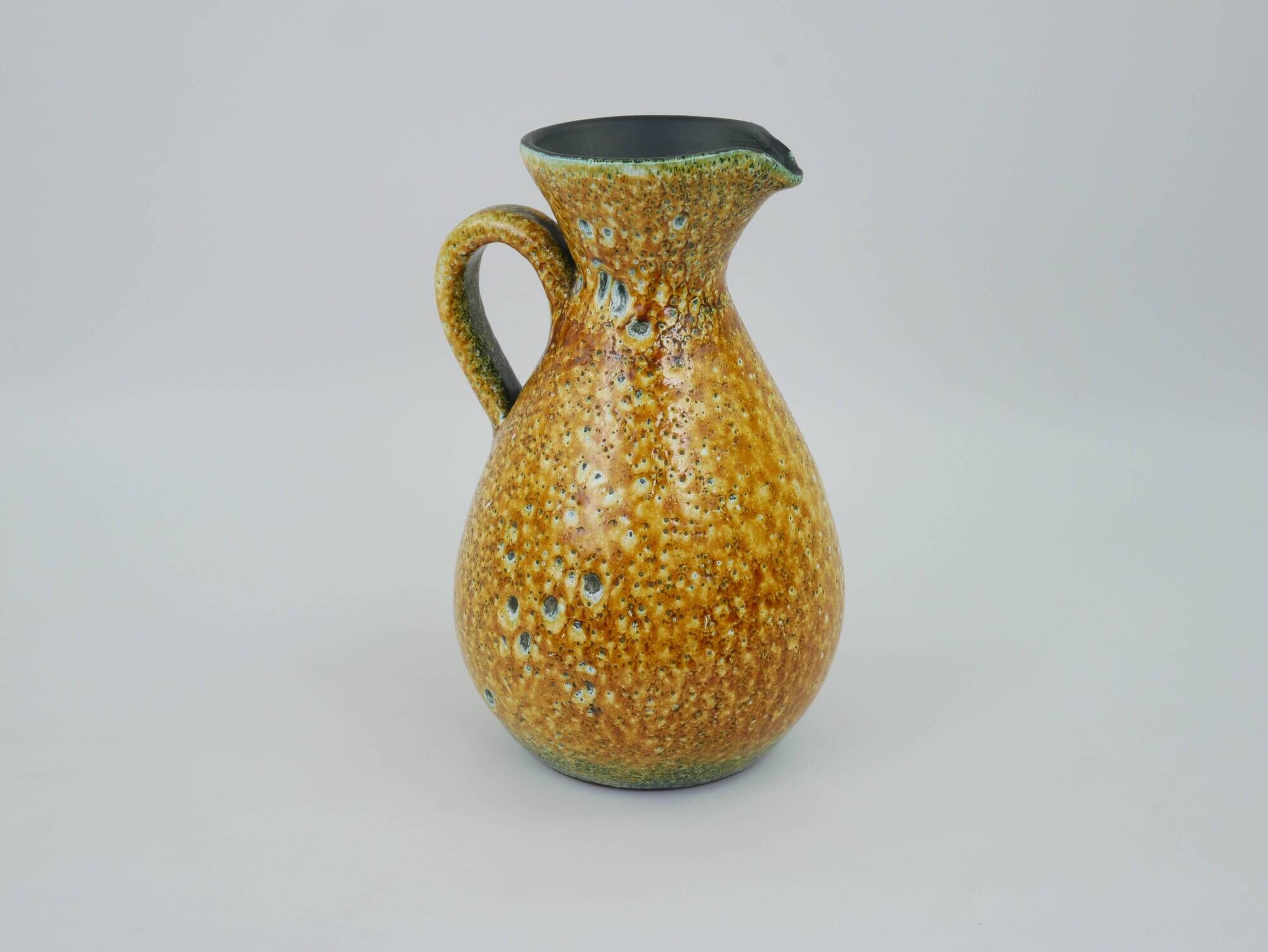 Large yellow ceramic pitcher in the Accolay style