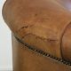 Aged sheepskin clubchair with beautiful vintage patina and comfortable seat