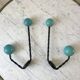 Duo of hooks balls in blue wood and black iron 60s