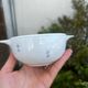 Set of seven earthenware bowls, Quimper, lily flower decoration.