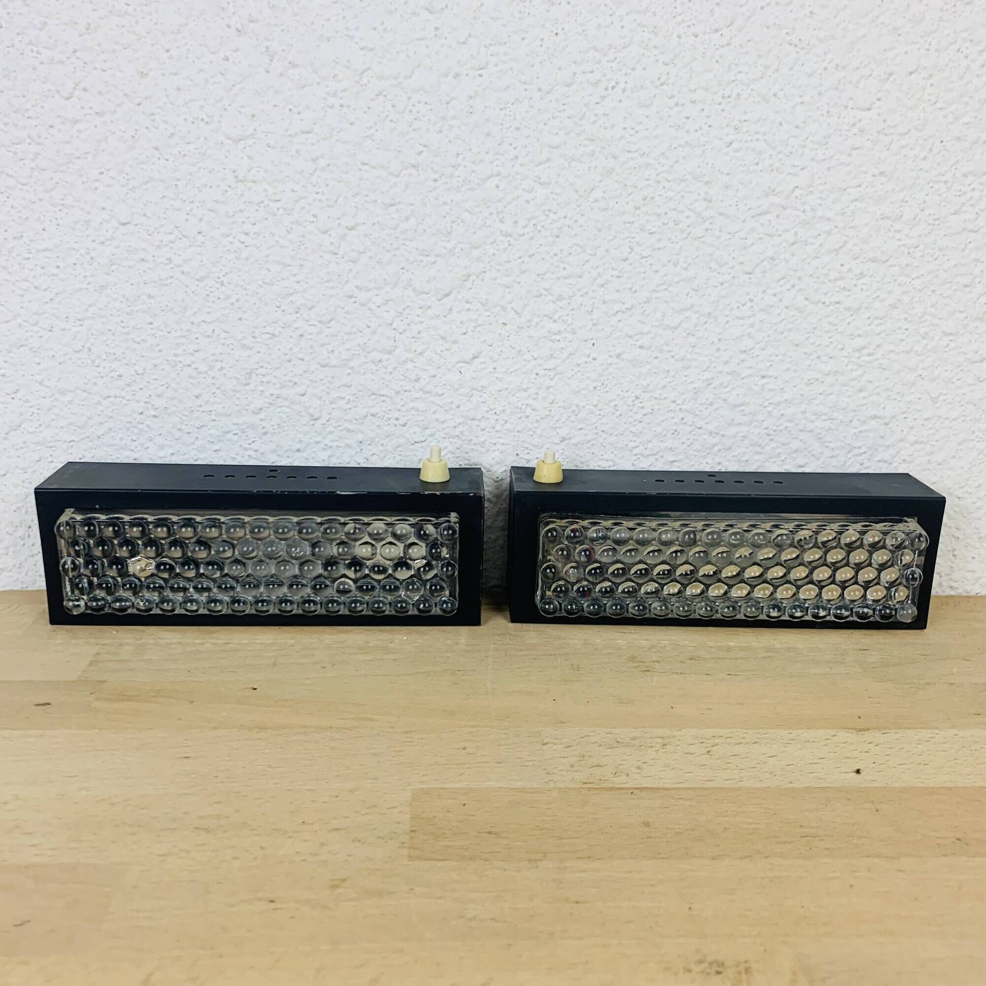 Pair of molded glass and metal wall lights from the 1950s