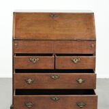 Antique English oak secretary from the 18th century with a stepped interior