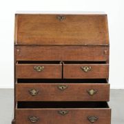 Antique English oak secretary from the 18th century with a stepped interior