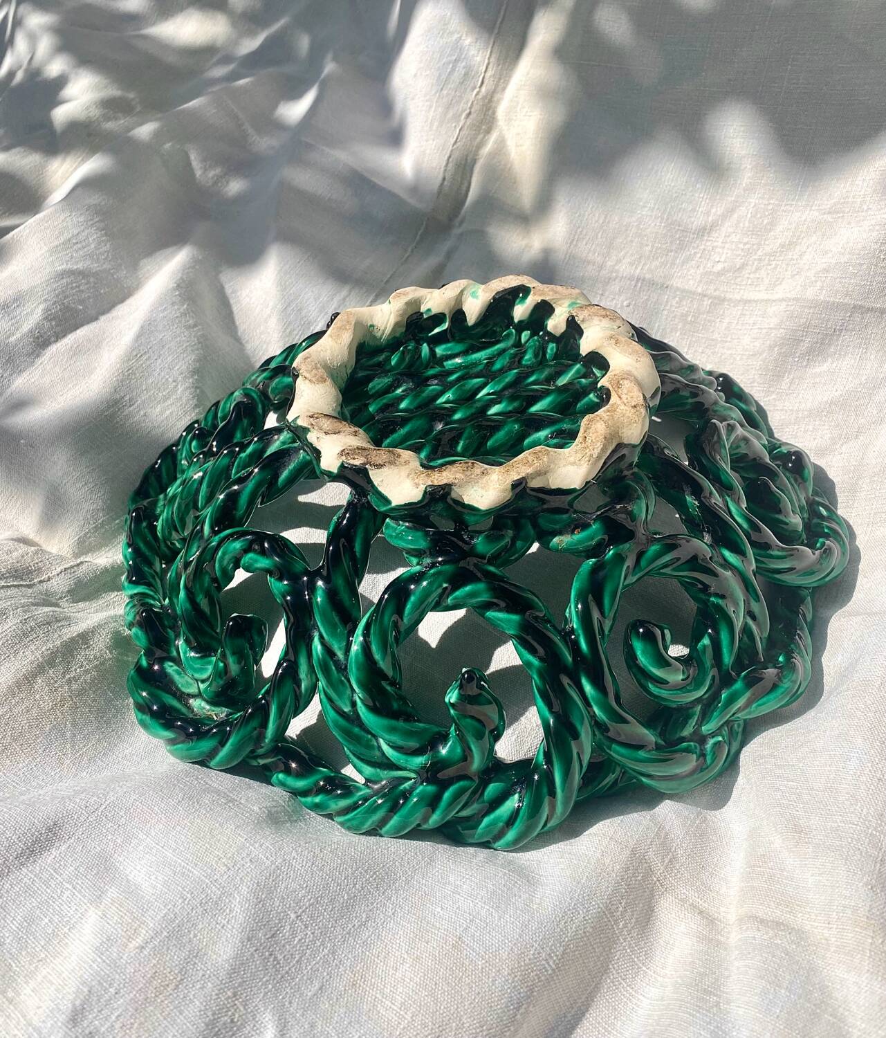 Large twisted green enamelled bowl
