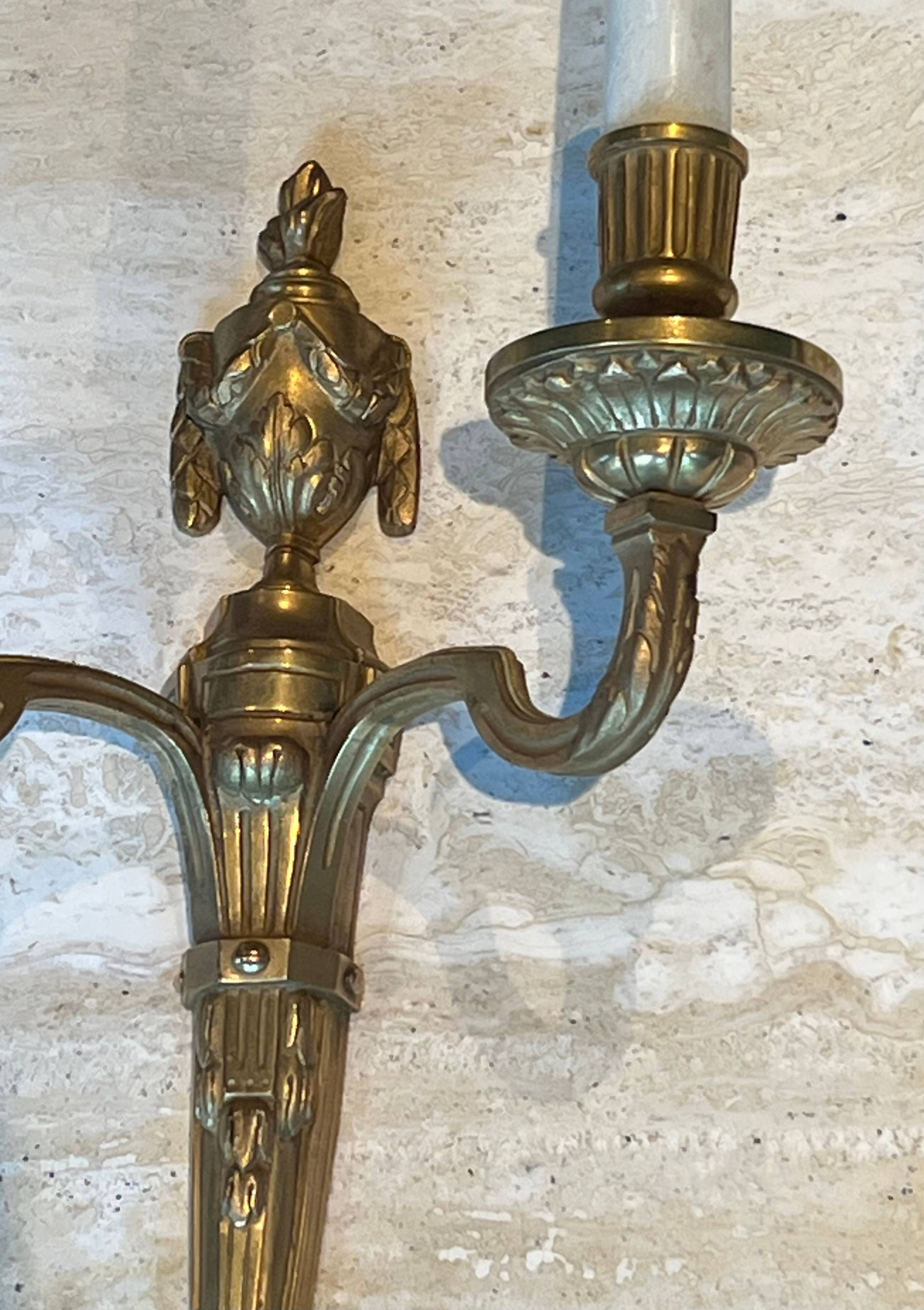 Set of 4 bronze wall lights in Louis XVI style.