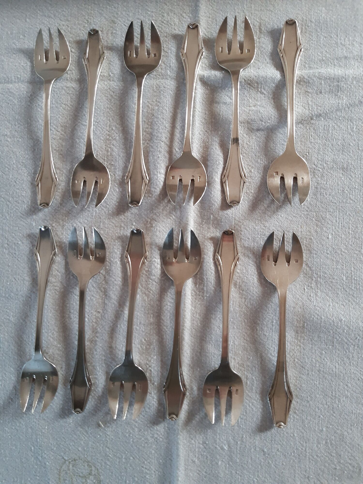 12 fourchettes à huitres métal argenté  art deco ravinet d'enfert