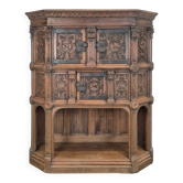 Richly carved Renaissance-style credenza with mascarons.