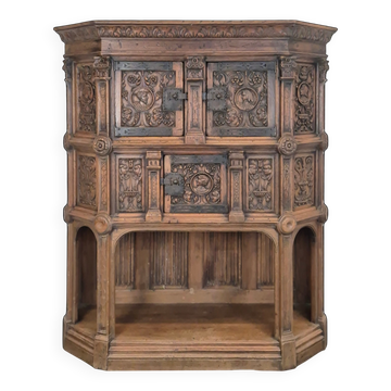 Richly carved Renaissance-style credenza with mascarons.