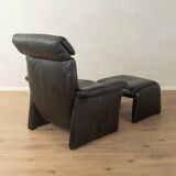 1980s cor armchair and ottoman in black leather