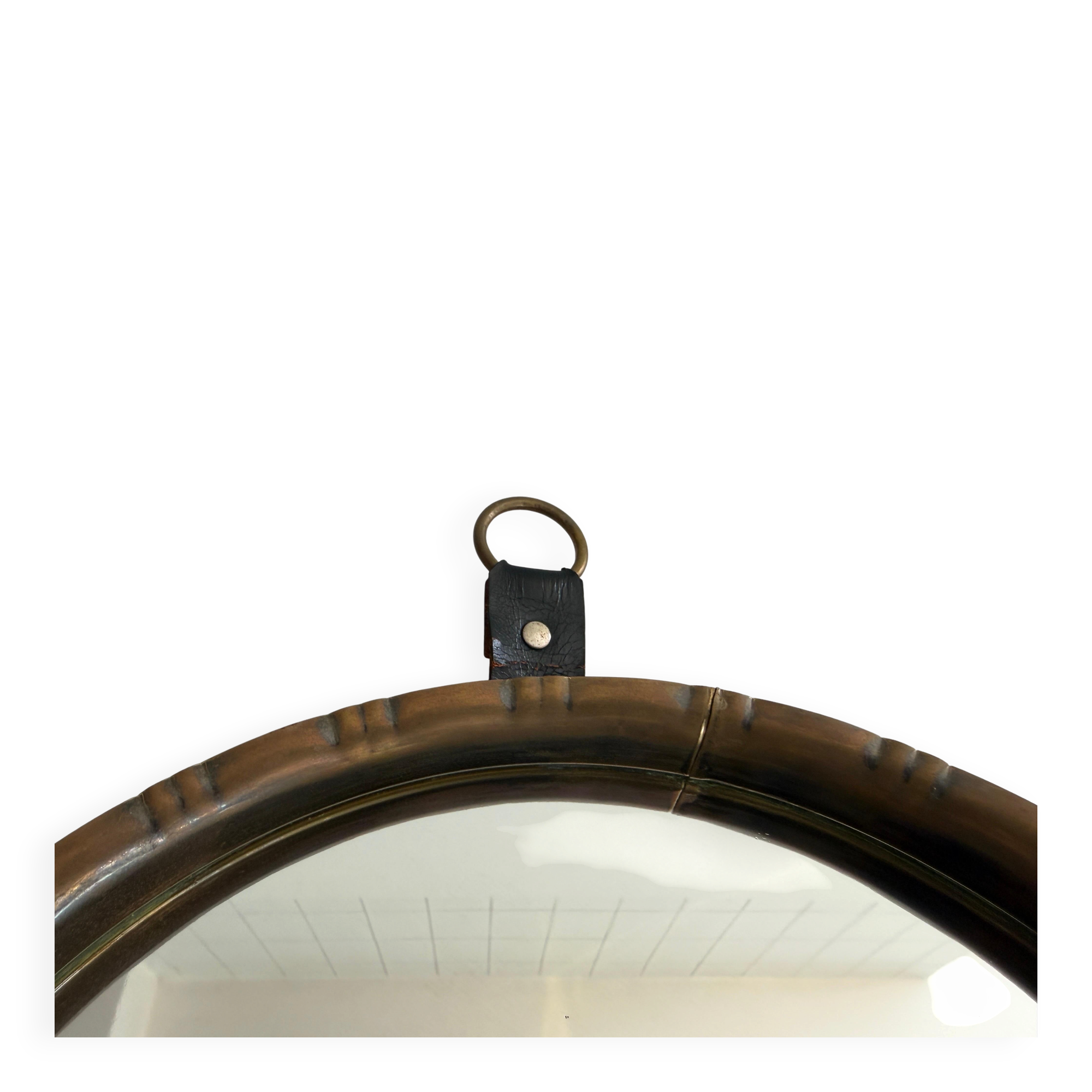 Round wall mirror with brass frame and leather hanger, 1960, Germany