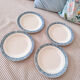 Lot de 4 belles assiettes plates en terre de fer