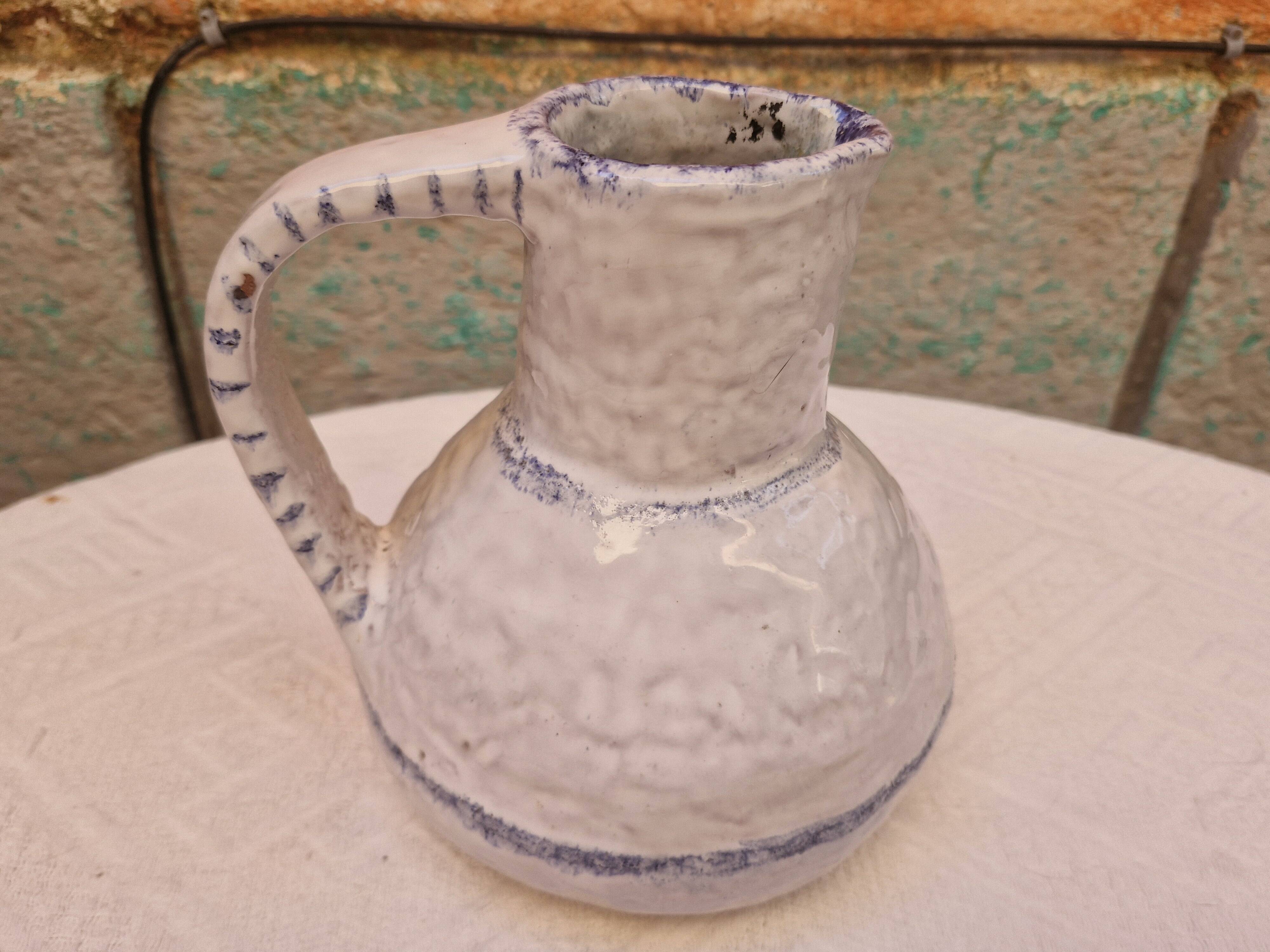 Old stamped glazed terracotta jug