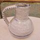 Old stamped glazed terracotta jug