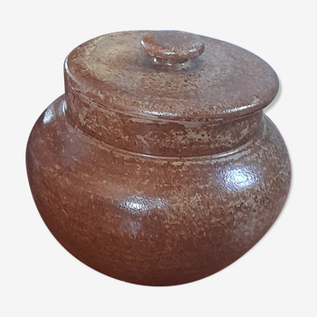 Old salt pot in sandstone, with lid