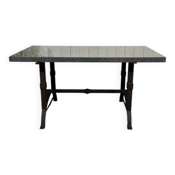 Marble table with cast iron base.