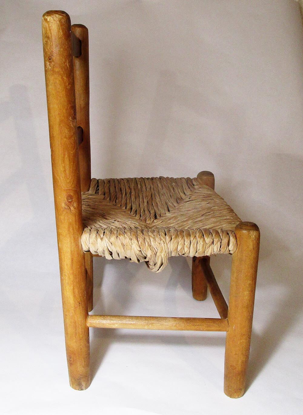 Old child chair in wood and straw