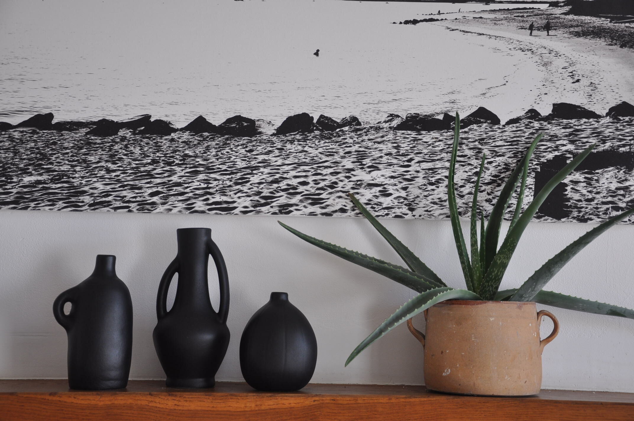 Trio of vintage black vases