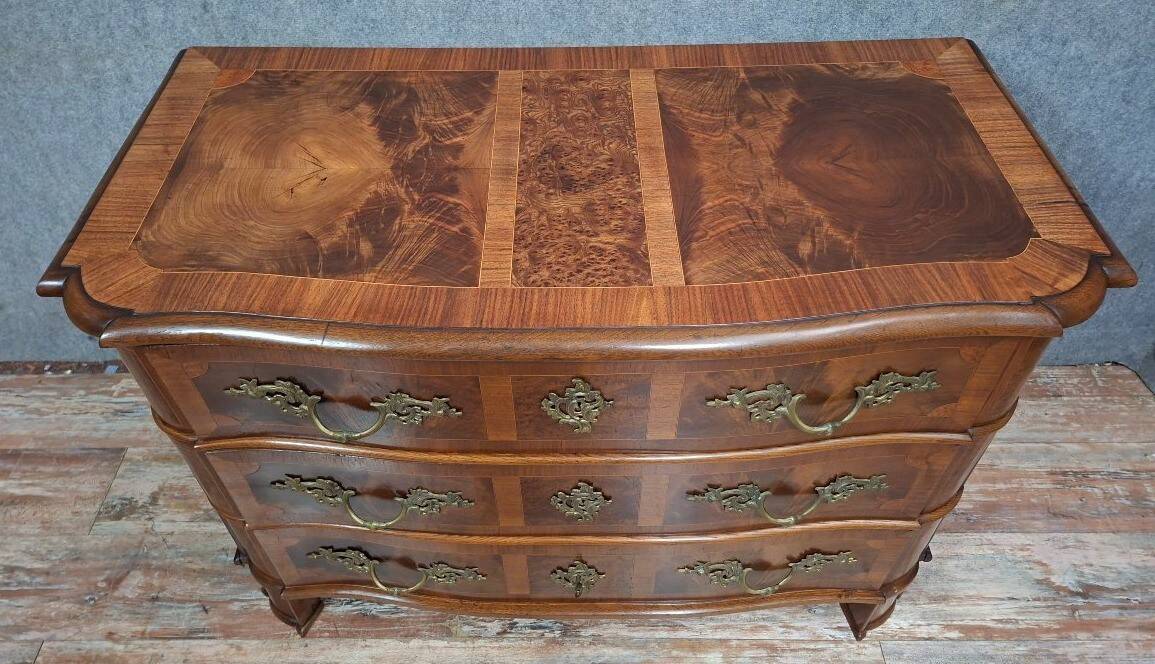 Curved commode from the Louis XIV period in marquetry - adorned with gilded bronze fittings.