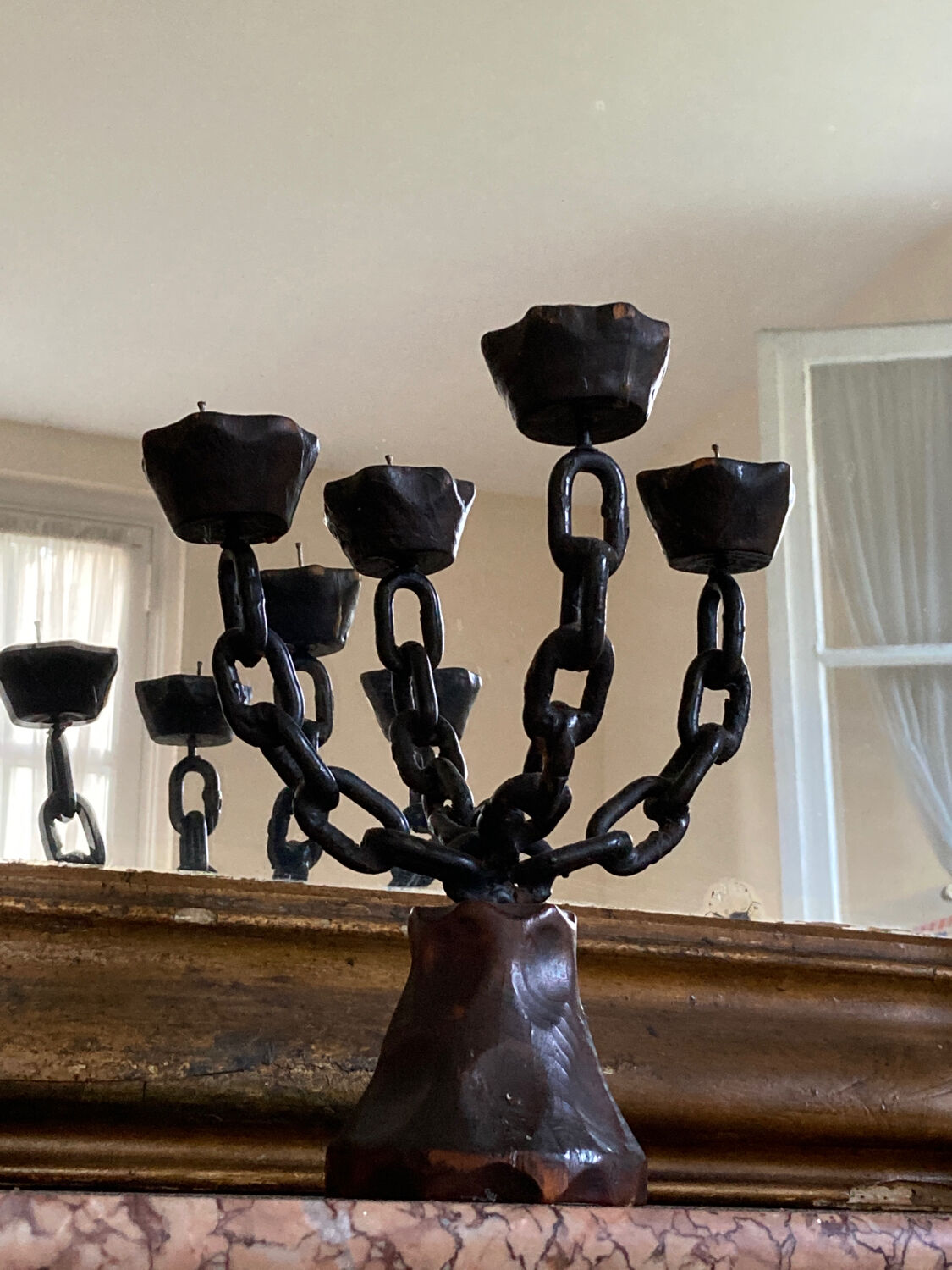Brutalist iron and wood chain candle holder from the 1970s