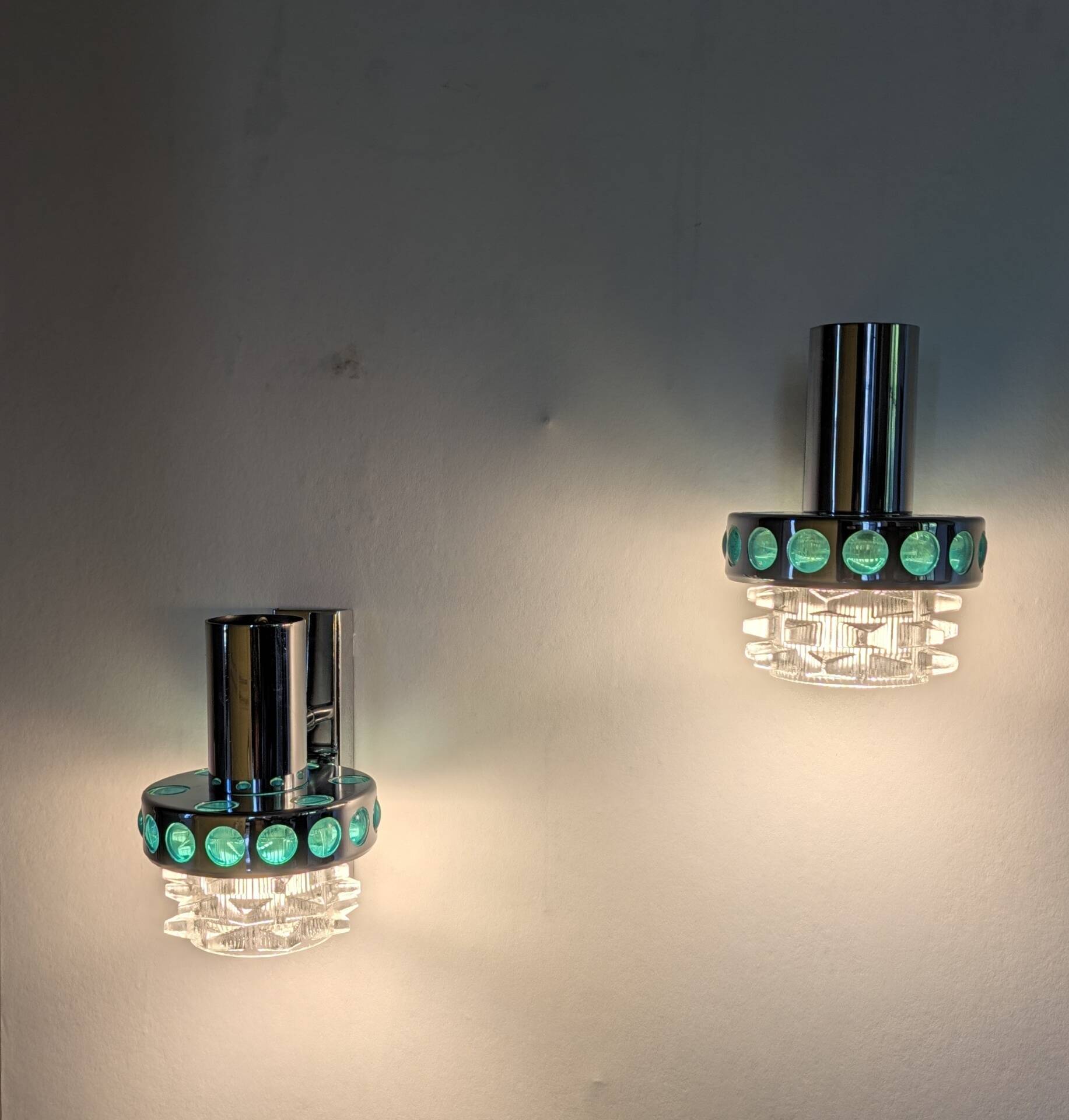 Pair of Space Age wall lights in chrome and green glass, 1970s.