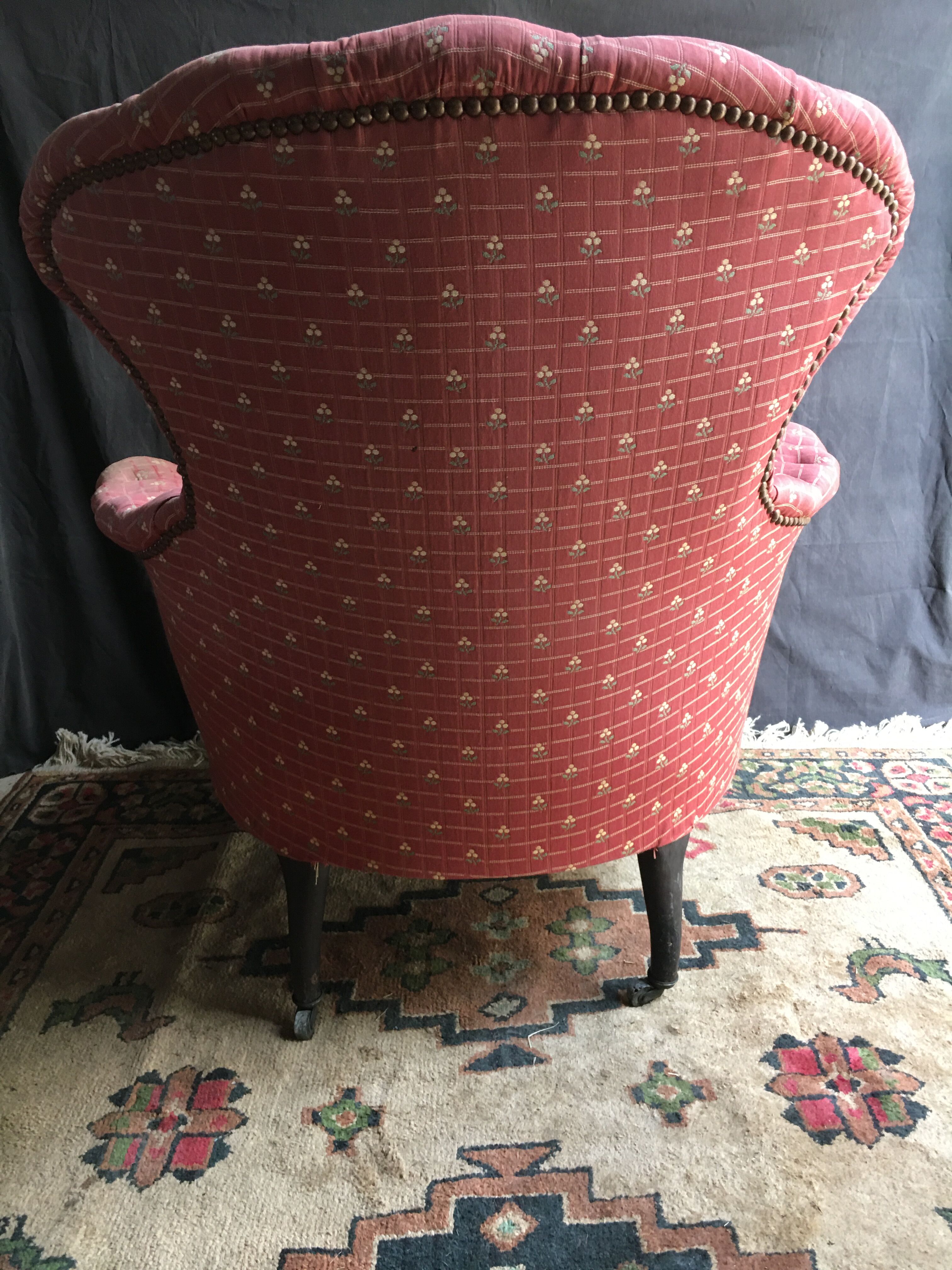 Pair of toad armchairs on wheels, upholstered.