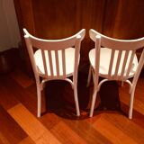 Pair of painted white bistro chairs
