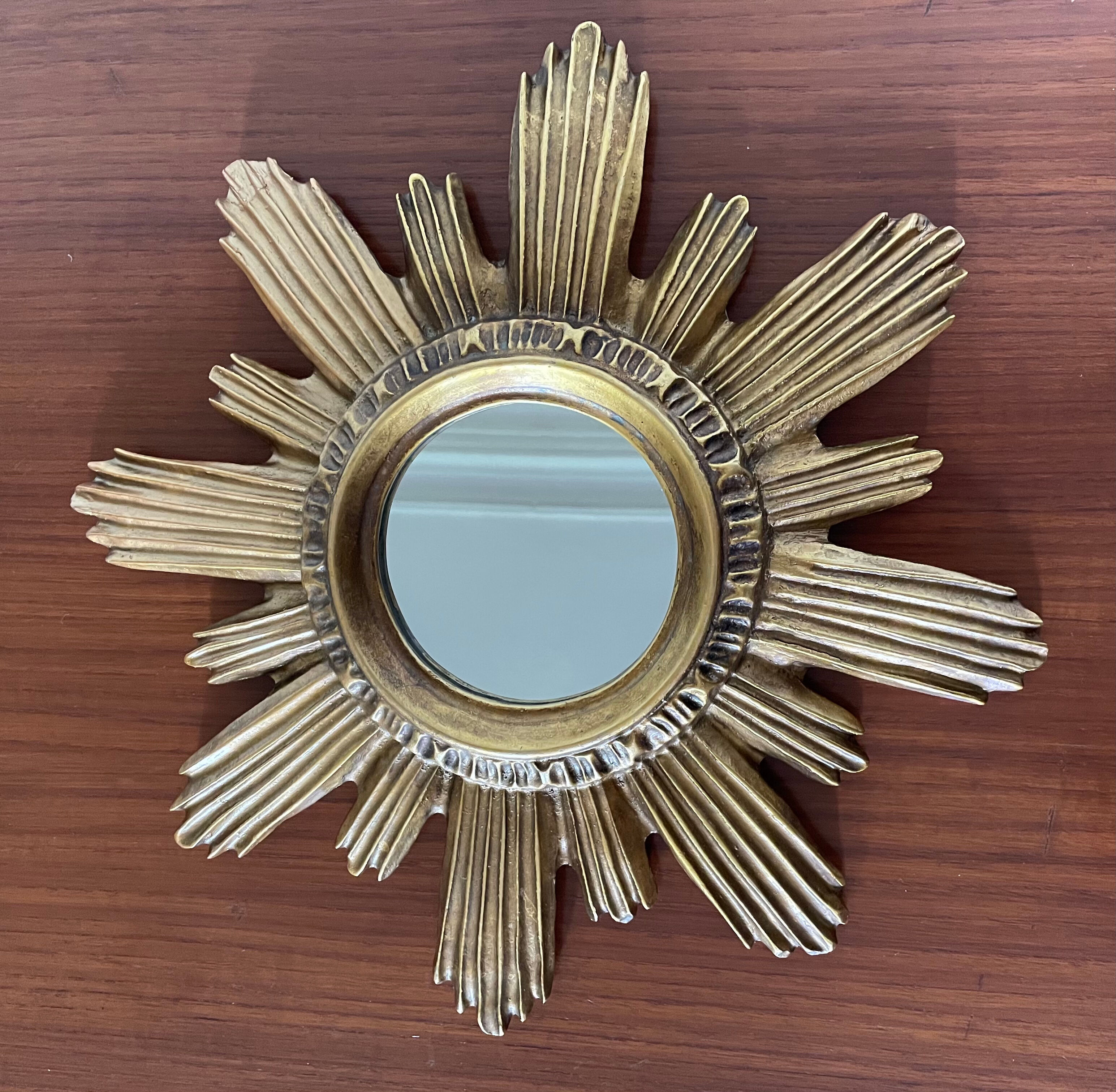 Vintage sun mirror in 60s/70s gold resin