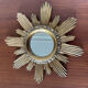 Vintage sun mirror in 60s/70s gold resin