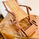 Vintage wooden folding doll's deckchair on wheels