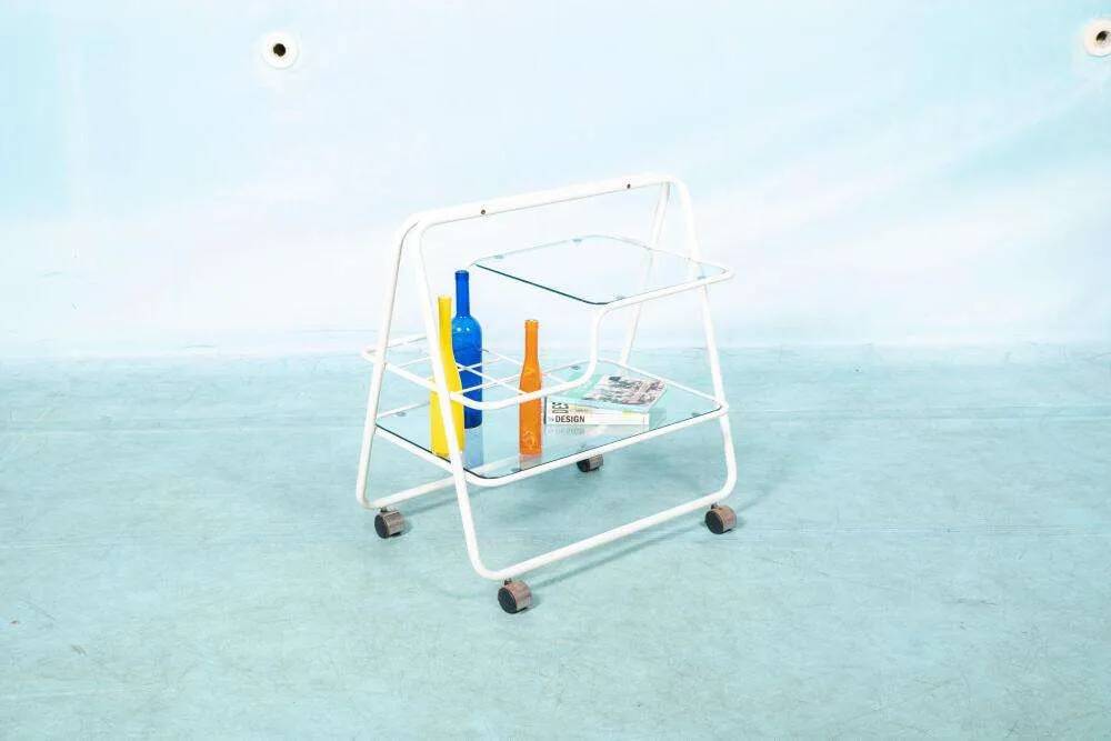Space age dessert trolley from the 1970s, with metal tubes and glass trays.