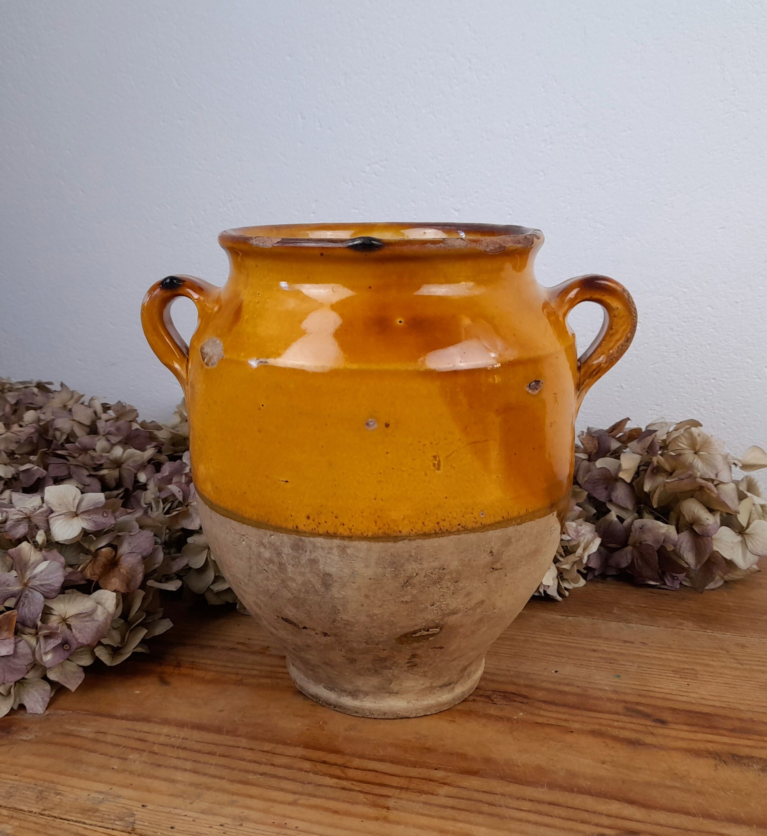 Old glazed terracotta grease pot