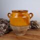Old glazed terracotta grease pot