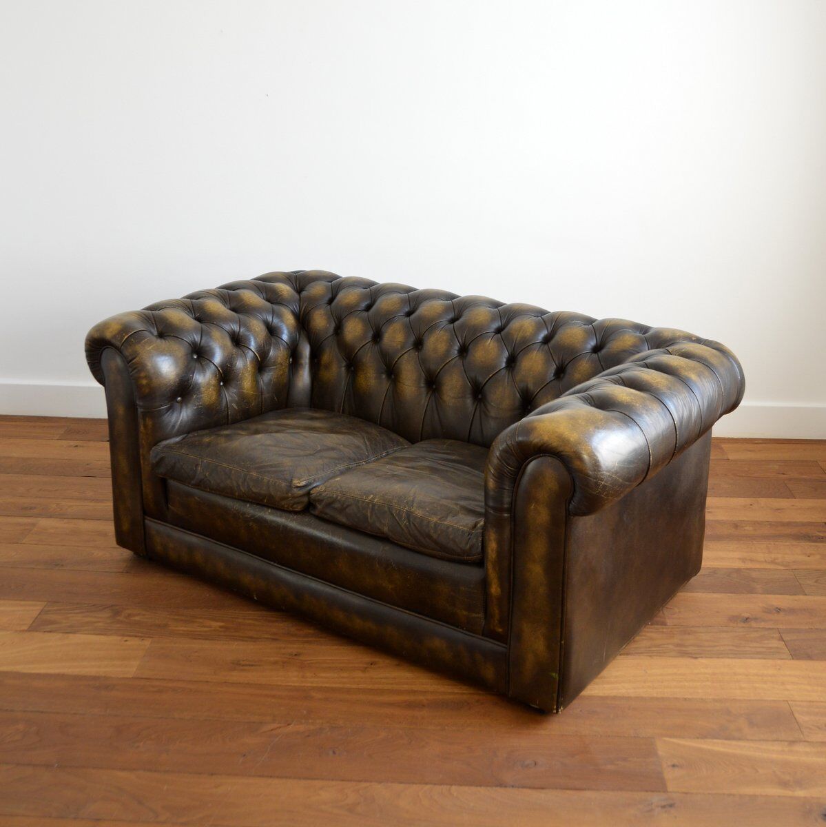 Vintage two-seater leather Chesterfield sofa
