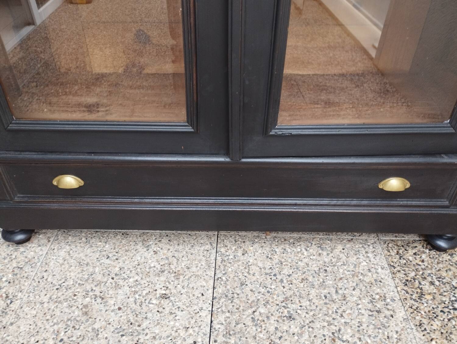 Bookcase black patina shell pediment 2 drawer doors