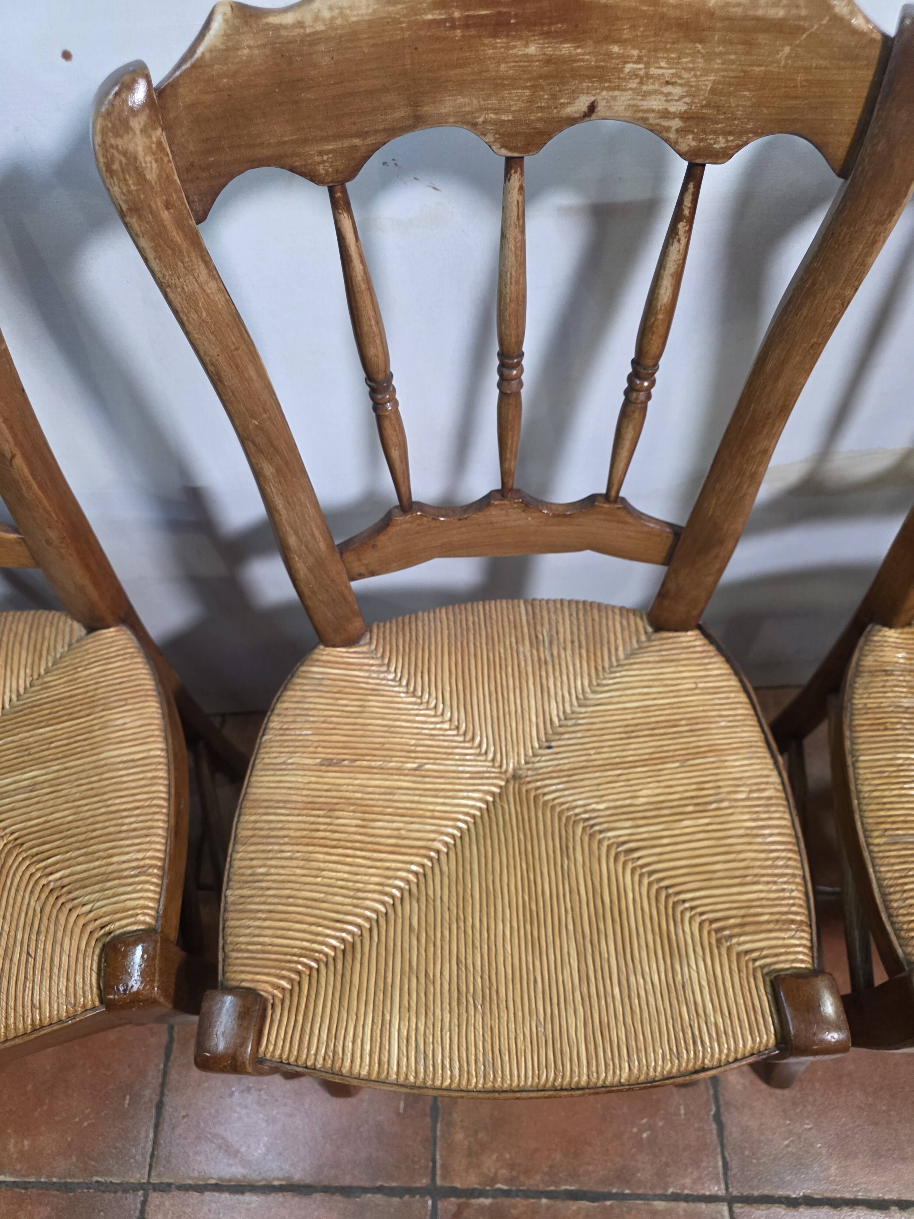 4 rustic farmhouse chairs made of wood and straw